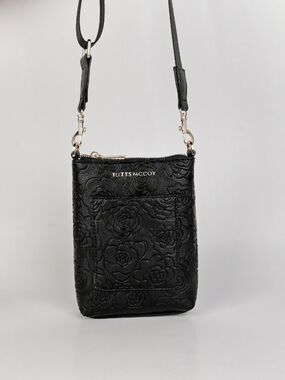 Black Floral Embossed Crossbody Bag by Tutts Mccoy